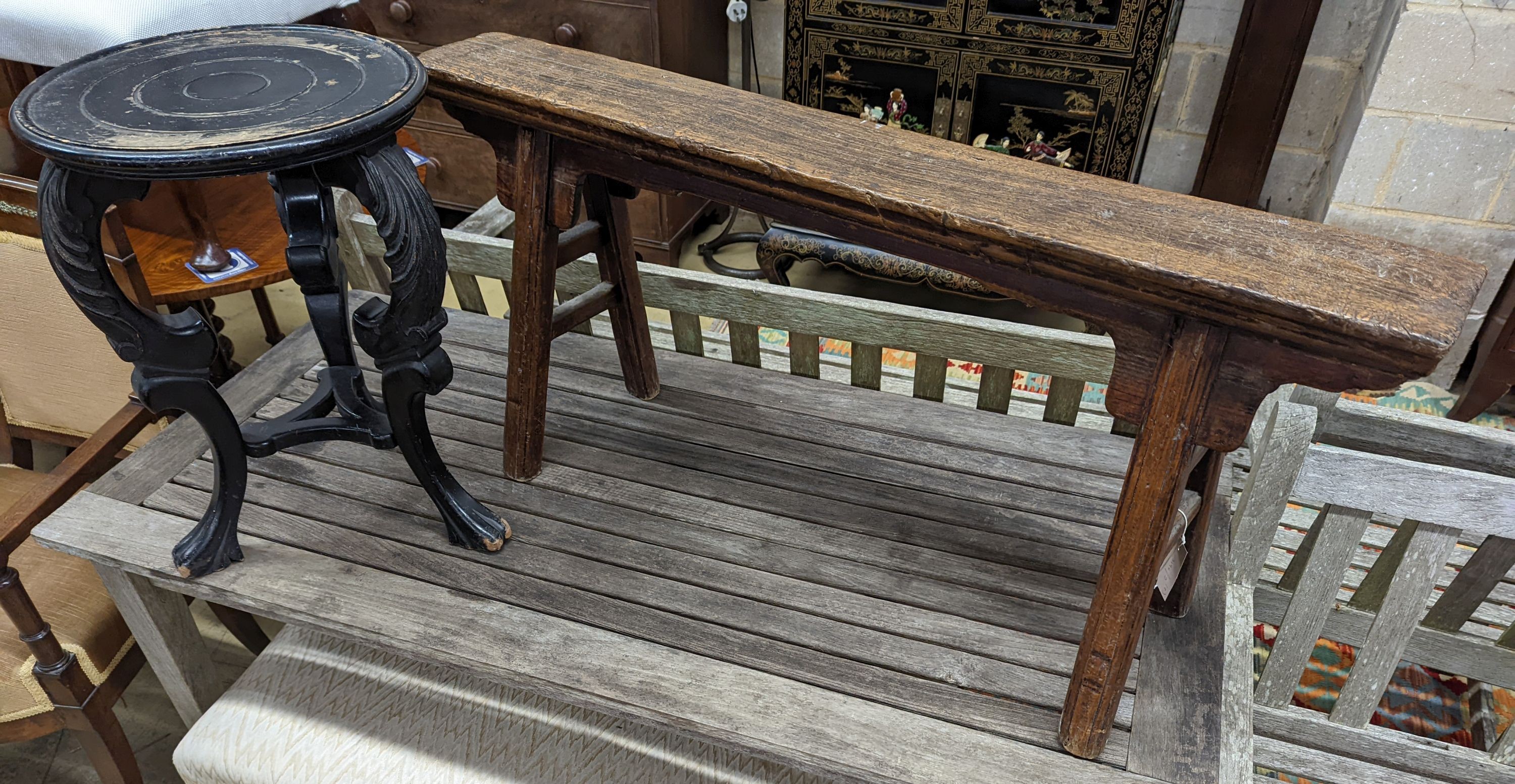 A Chinese elm bench, length 114cm, depth 29cm, height 51cm together with a circular ebonised vase stand